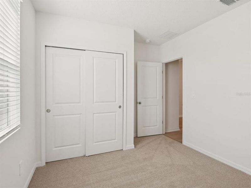 Spacious, unfurnished interior of a new home in The Grove at Stuart Crossing - Classic Series, Bartow (Image 12).