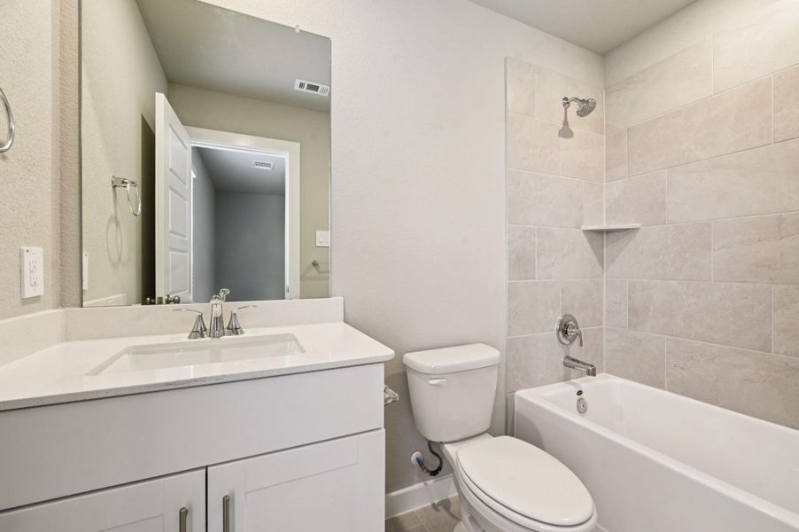 Furnished interior view inside a new home in Heights of Barbers Hill, Mont Belvieu (Image 12).