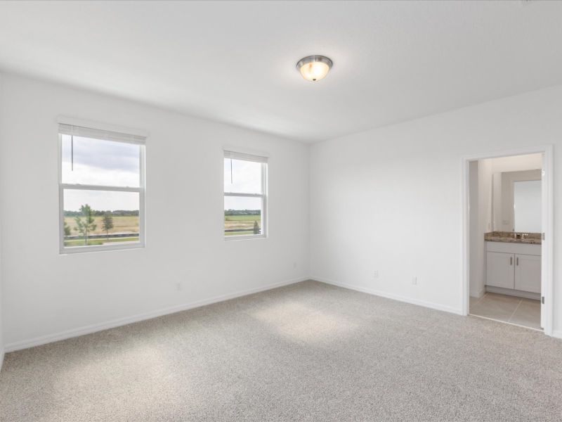 Primary bedroom in Ellison floorplan at 4621 Cross Prairie Parkway in The Meadow at Crossprairie