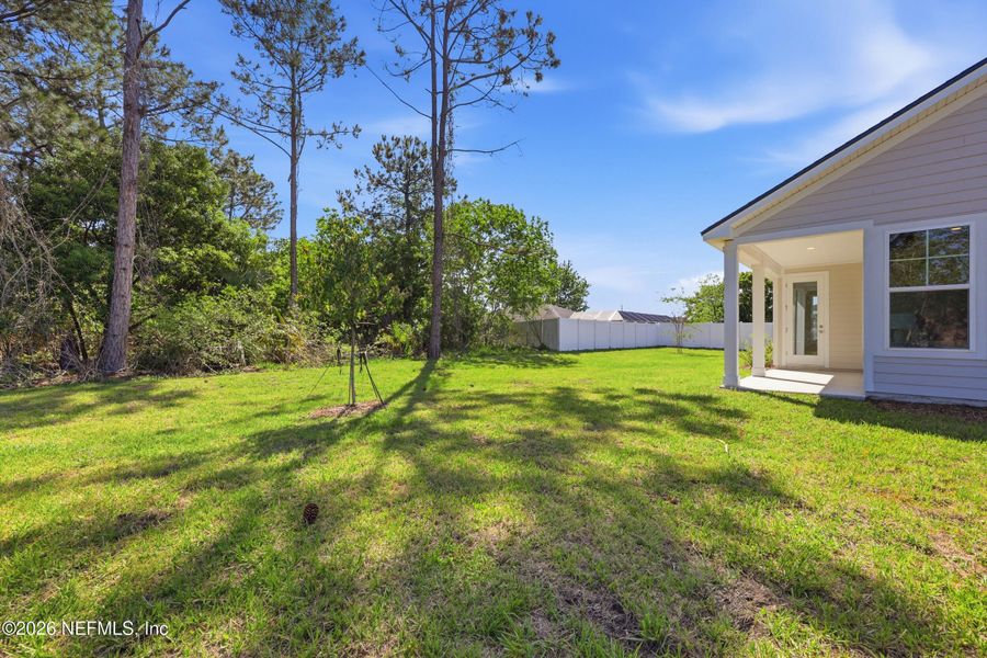 Exterior details and patio area of a home in Palm Coast Homes, Palm Coast (Image 4).