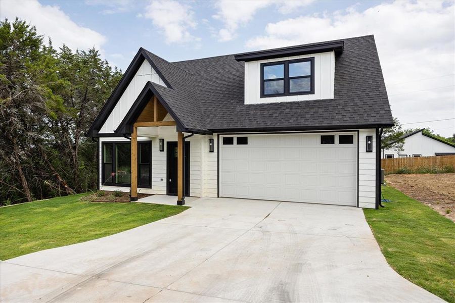 Front exterior of a new home in , Granbury, TX, highlighting curb appeal (Image 23).