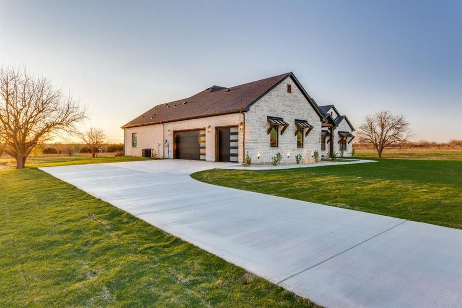 3-car garage and a long driveway