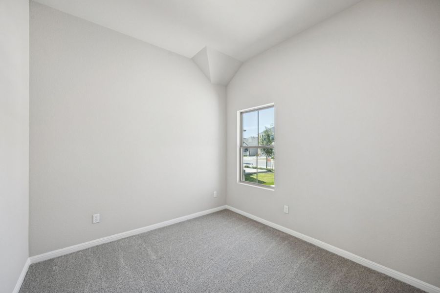 Bedroom in the Pine home plan by Trophy Signature Homes - REPRESENTATIVE PHOTO