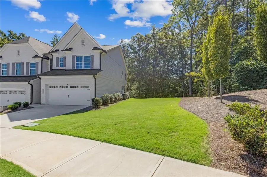 Front exterior of a new home in , Duluth, GA, highlighting curb appeal (Image 28). Front exterior of a new home in , Duluth, GA, highlighting curb appeal (Image 28).
