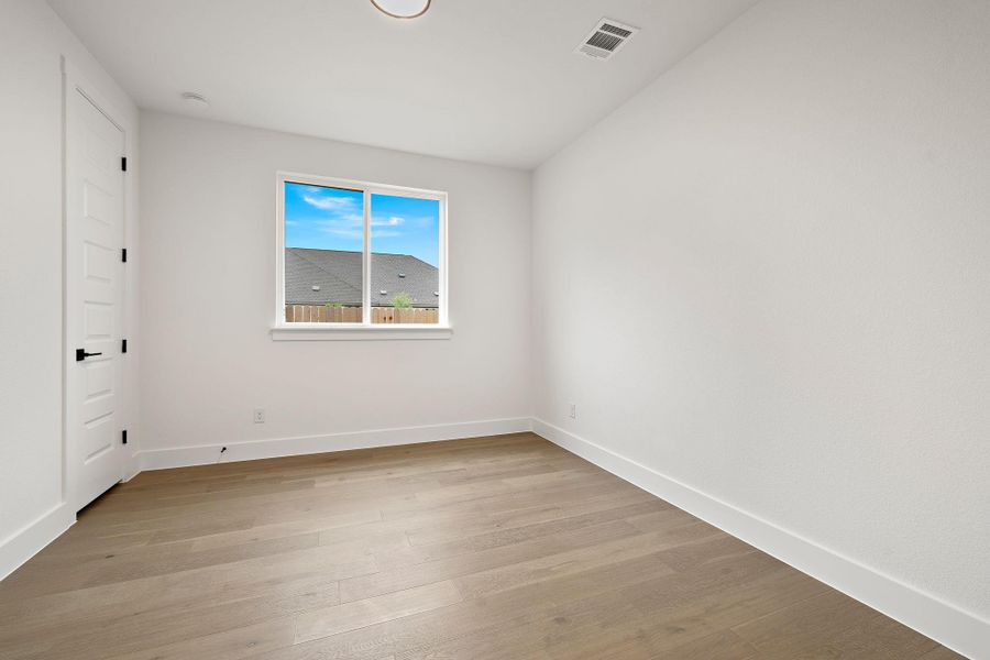 Spacious, unfurnished interior of a new home in Blackhawk in Pflugerville, Pflugerville (Image 22).