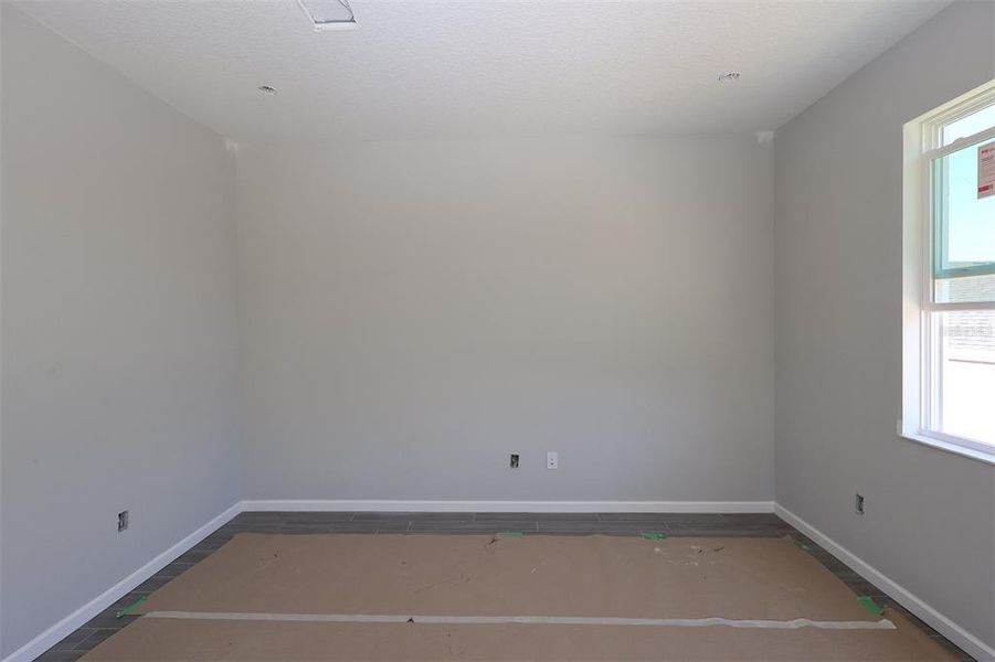 Spacious, unfurnished interior of a new home in Tribute at Ovation, Winter Garden (Image 8).