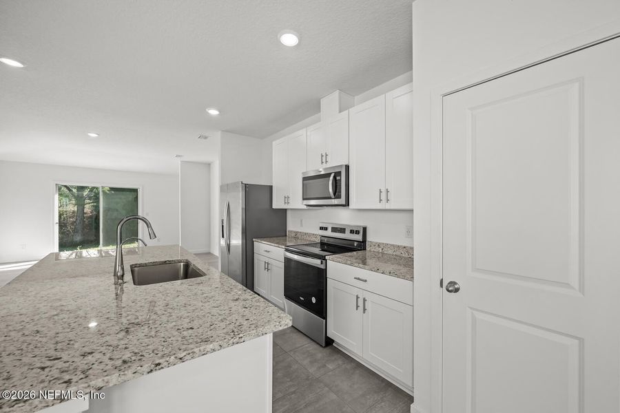 Furnished interior view inside a new home in Lakes at Bella Lago – Classic Series, Green Cove Springs (Image 11).