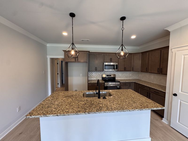 Furnished interior view inside a new home in The Greens at Legacy Townhomes, Springfield (Image 7).