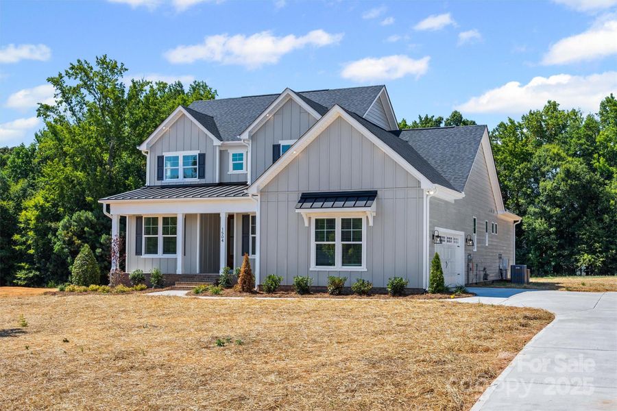Front exterior of a new home in , Gastonia, NC, highlighting curb appeal (Image 16).