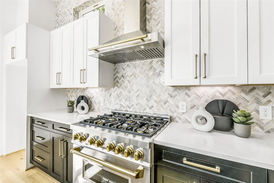 Every builder detail speaks to quality: 6-burner gas range, solid brass handles, and custom herringbone marble tile backsplash extending to the ceiling.This space defines craftsmanship—where function meets artistry, built to satisfy both culinary enthusiasts and those who simply love beautifuldesign.