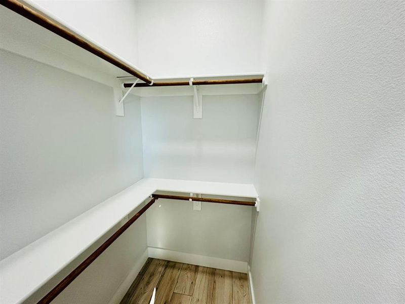 Walk in closet featuring hardwood / wood-style floors