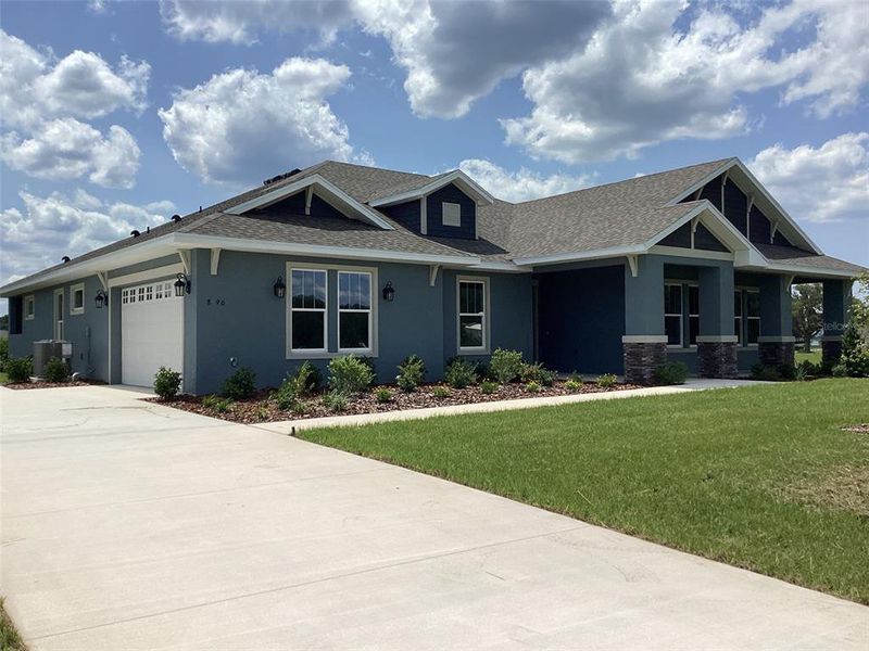 Front exterior of a new home in , Ocala, FL, highlighting curb appeal (Image 2).