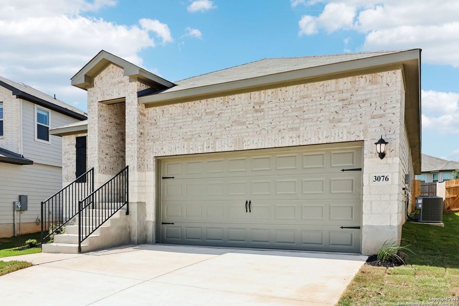 Front exterior of a new home in Lark Canyon, New Braunfels, TX, highlighting curb appeal (Image 23).