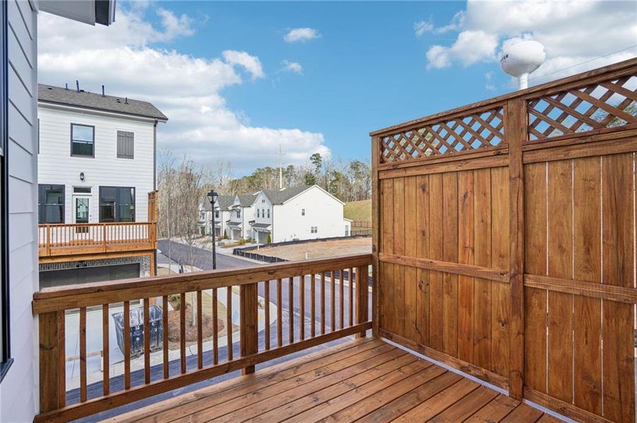 Exterior details and patio area of a home in Palisades Townhomes, Cumming (Image 3).