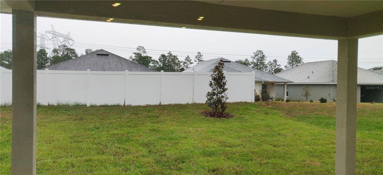 Exterior details and patio area of a home in Sunset Landing, Spring Hill (Image 2).