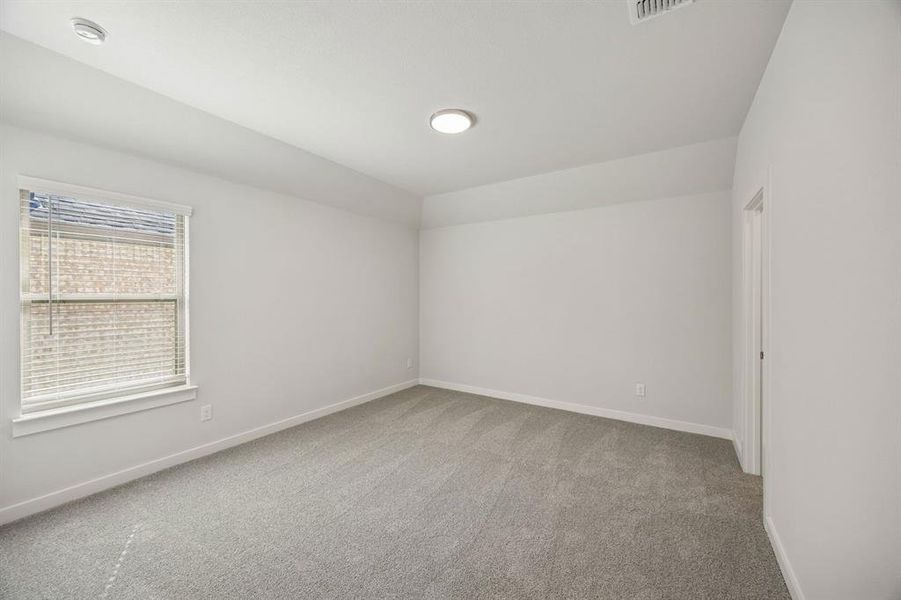 Bedroom in the Wimbledon home plan by Trophy Signature Homes – REPRESENTATIVE PHOTO