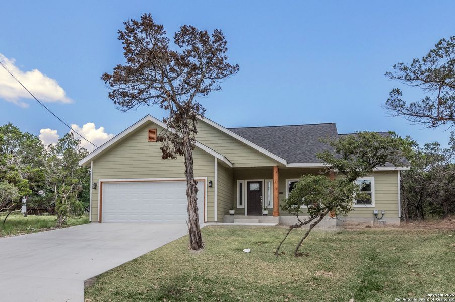 Front exterior of a new home in , Canyon Lake, TX, highlighting curb appeal (Image 2).
