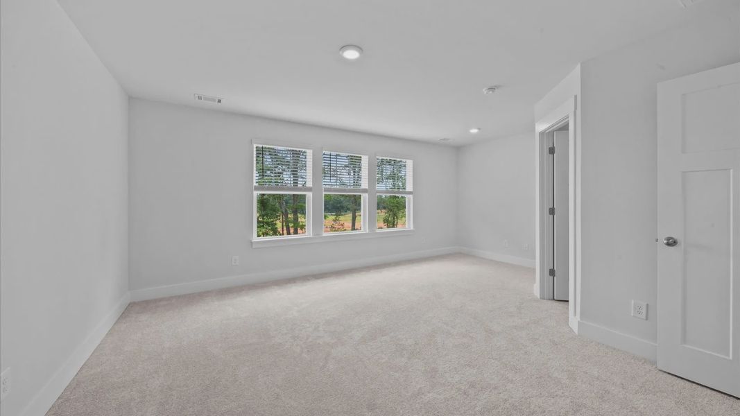 Accomplished design meets restful elegance in this exclusive primary suite by DRB Homes