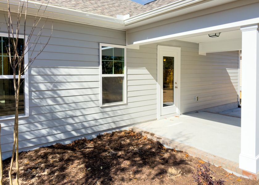 Exterior details and patio area of a home in Osprey Landing, Southport (Image 4).