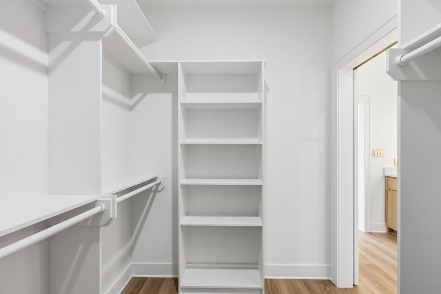 Primary closet with built-in shelving Primary closet with built-in shelving