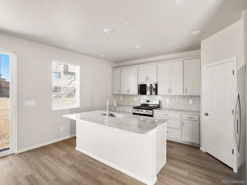 Furnished interior view inside a new home in Buffalo Highlands: The Flora Collection, Commerce City (Image 6).