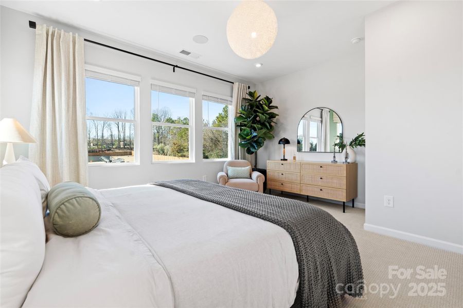 9' Ceilings and 8' Doorways at Primary Suite.