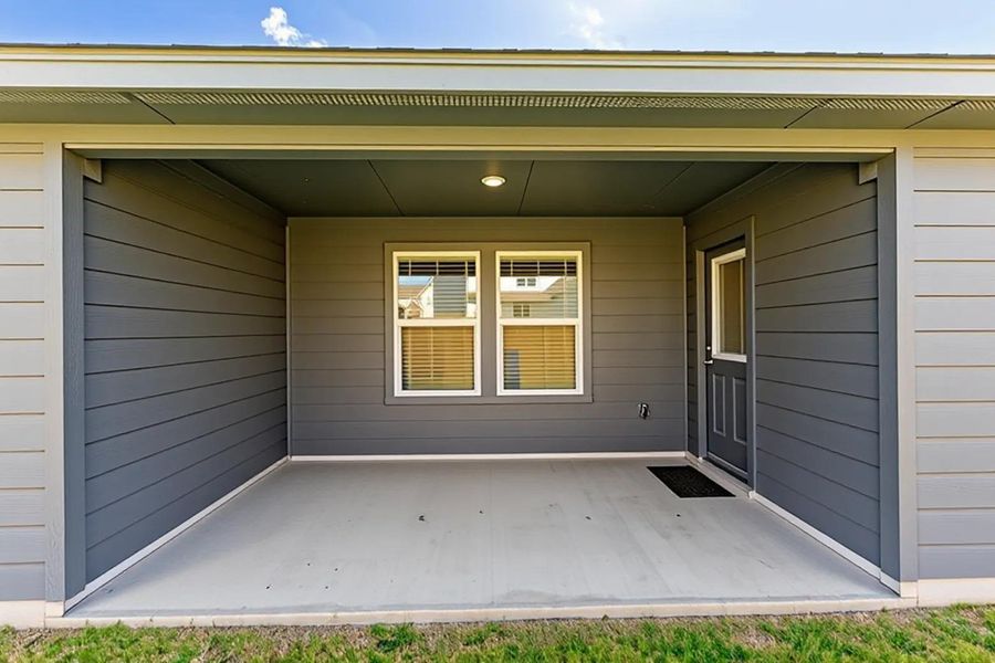 A well-appointed covered patio offers an inviting outdoor retreat. A well-appointed covered patio offers an inviting outdoor retreat.