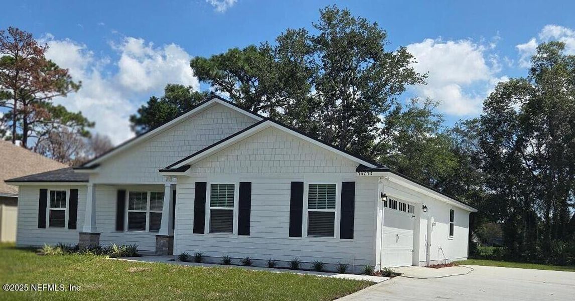 Front exterior of a new home in , Jacksonville, FL, highlighting curb appeal (Image 1). Front exterior of a new home in , Jacksonville, FL, highlighting curb appeal (Image 1).