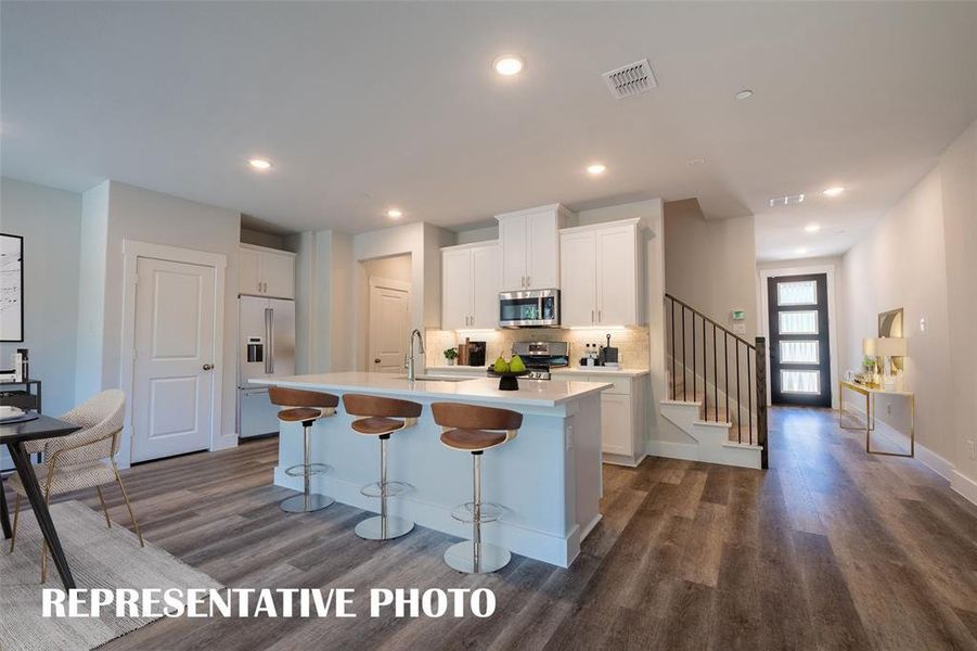 The chef will never be left out of the party in this outstanding kitchen!   REPRESENTATIVE PHOTO VIRTUALLY STAGED