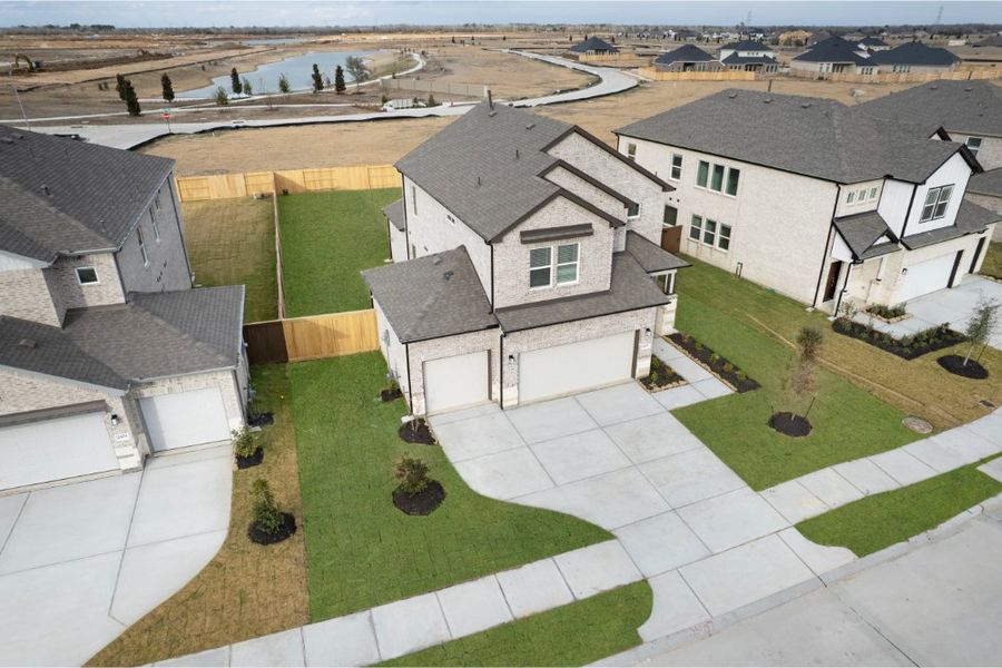 Front exterior of a new home in Creekhaven, Iowa Colony, TX, highlighting curb appeal (Image 18). Front exterior of a new home in Creekhaven, Iowa Colony, TX, highlighting curb appeal (Image 18).