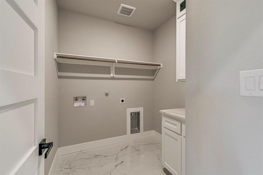 Laundry area with visible vents, gas dryer hookup, hookup for an electric dryer, washer hookup, and marble finish floor