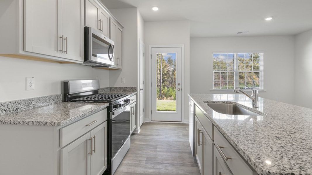 Furnished interior view inside a new home in The Townes at Ridgewood Farms, Winterville (Image 6).