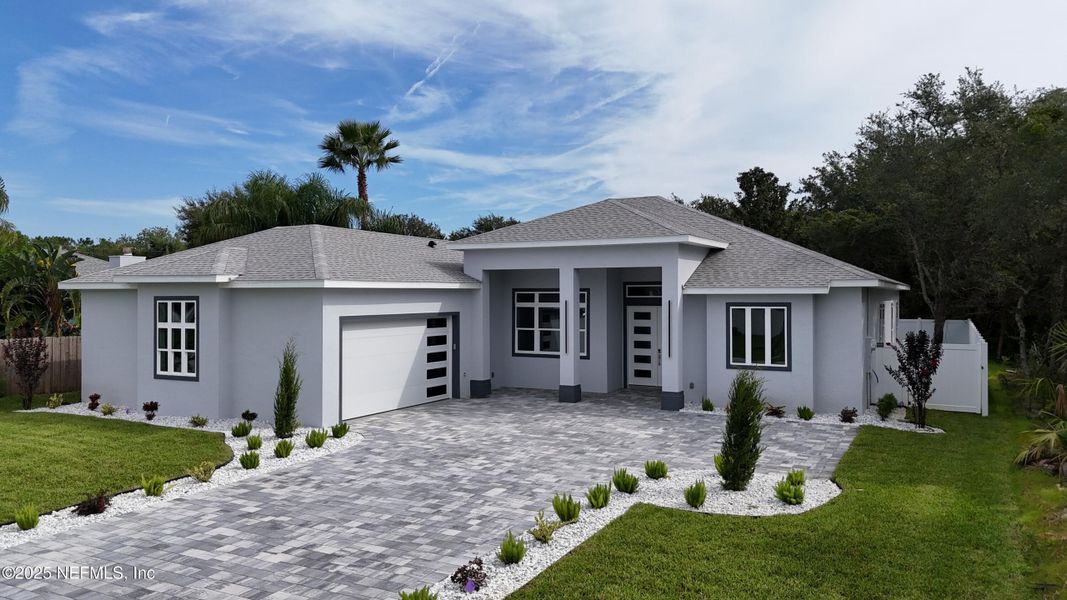 Front exterior of a new home in , Palm Coast, FL, highlighting curb appeal (Image 41). Front exterior of a new home in , Palm Coast, FL, highlighting curb appeal (Image 41).