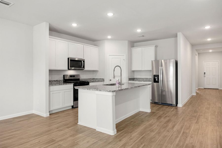Furnished interior view inside a new home in Granger Pines, Conroe (Image 5).
