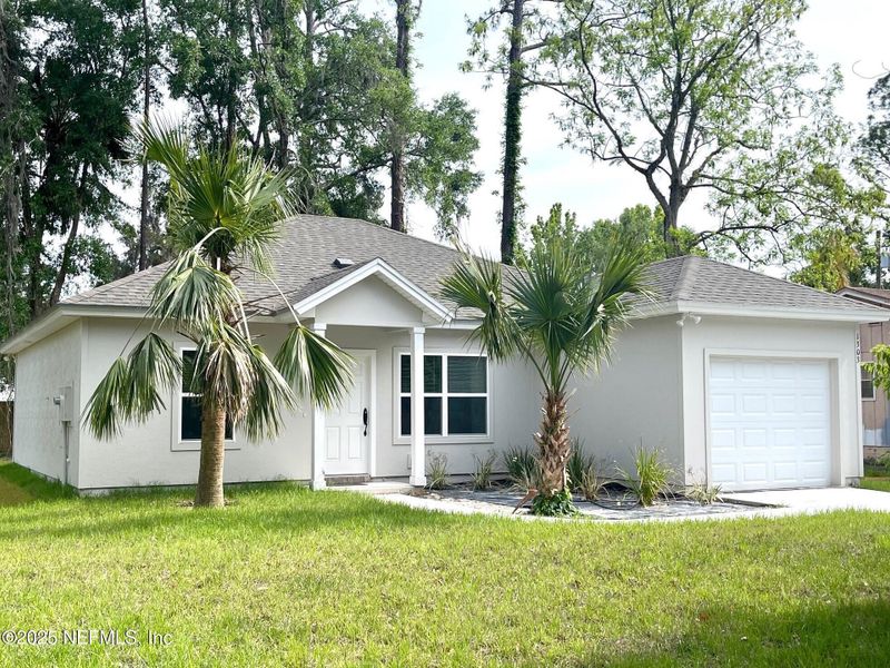 Front exterior of a new home in , Green Cove Springs, FL, highlighting curb appeal (Image 1).
