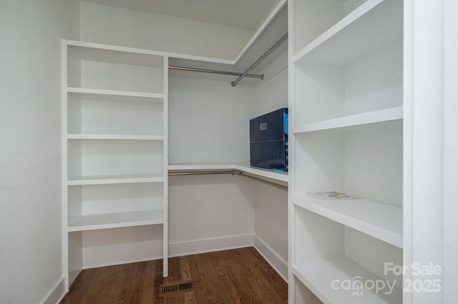 Primary walk-in closet with built-ins.