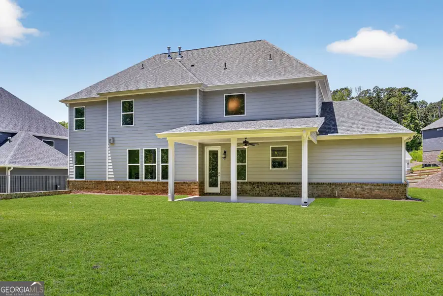 Exterior details and patio area of a home in The Manor at Gainesville Township, Gainesville (Image 18).