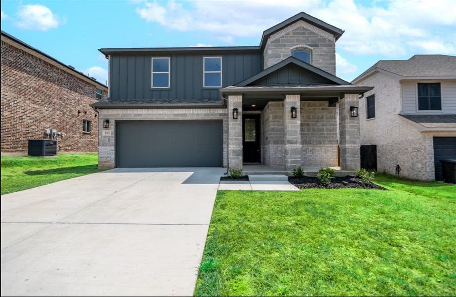 View of front of home featuring an attached garage, central AC, concrete driveway, board and batten siding, and a front yard View of front of home featuring an attached garage, central AC, concrete driveway, board and batten siding, and a front yard