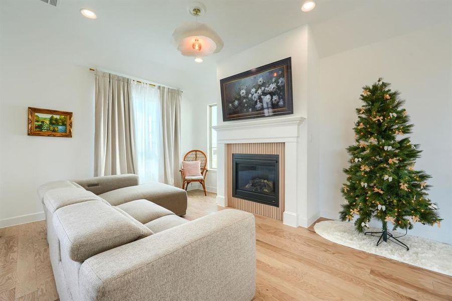 Living room with wood-type flooring