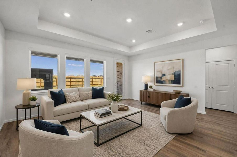 The living room sits at the back of the home with wide windows, recessed lighting, and a clean open layout. The space is designed as the main gathering point of the first floor. Virtually staged. The living room sits at the back of the home with wide windows, recessed lighting, and a clean open layout. The space is designed as the main gathering point of the first floor. Virtually staged.