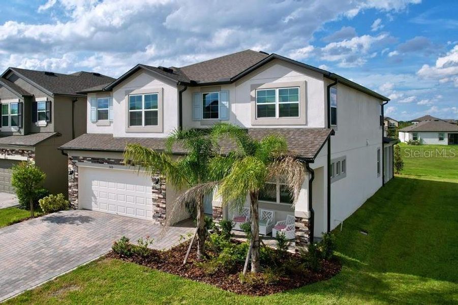 Front exterior of a new home in , Zephyrhills, FL, highlighting curb appeal (Image 25).
