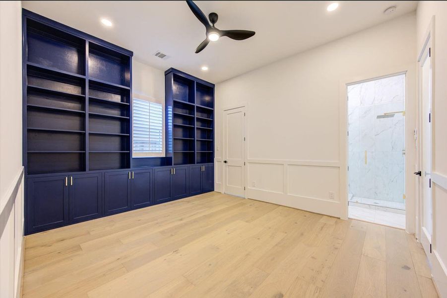 Spacious office with Texas-size adjustable shelves and tons of storage.