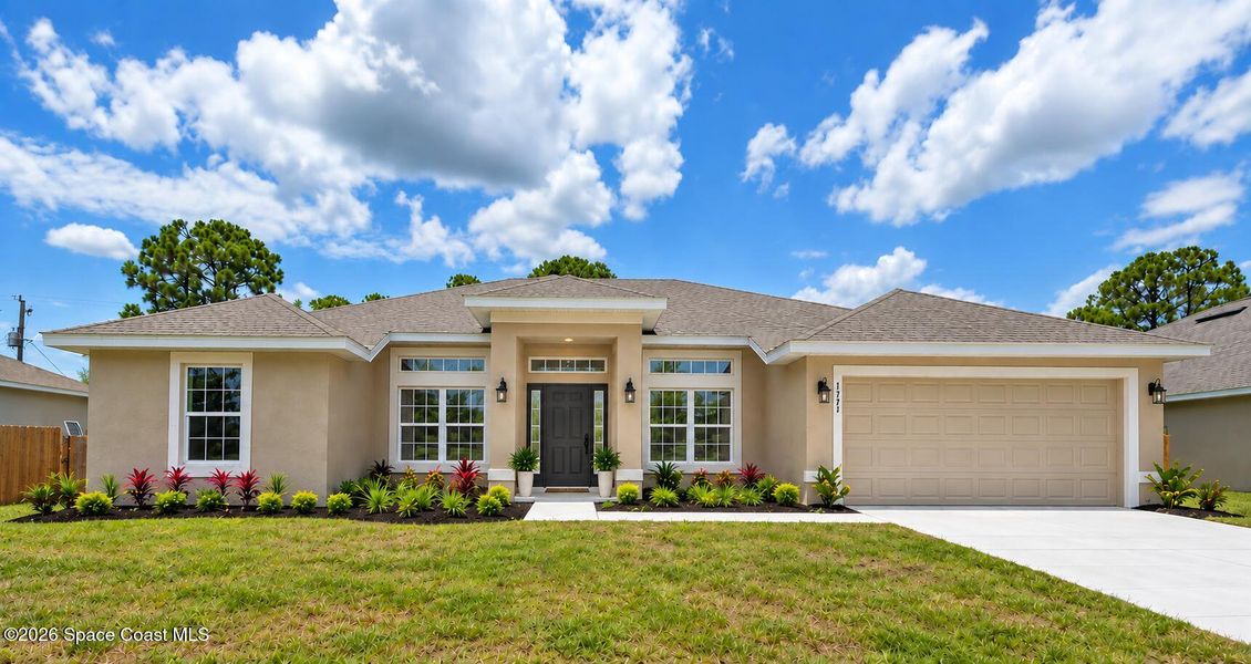 Front exterior of a new home in Palm Bay, Palm Bay, FL, highlighting curb appeal (Image 1). Front exterior of a new home in Palm Bay, Palm Bay, FL, highlighting curb appeal (Image 1).
