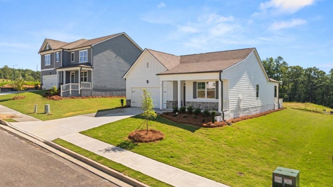 Front exterior of a new home in Sheffield Highlands, Dallas, GA, highlighting curb appeal (Image 1). Front exterior of a new home in Sheffield Highlands, Dallas, GA, highlighting curb appeal (Image 1).