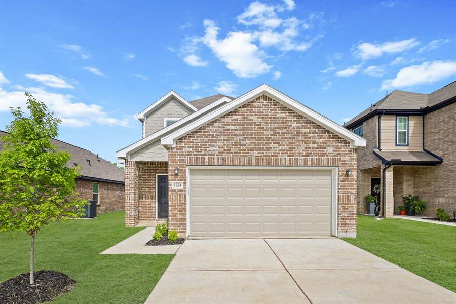 Front exterior of a new home in Christian Meadows, Ennis, TX, highlighting curb appeal (Image 2). Front exterior of a new home in Christian Meadows, Ennis, TX, highlighting curb appeal (Image 2).