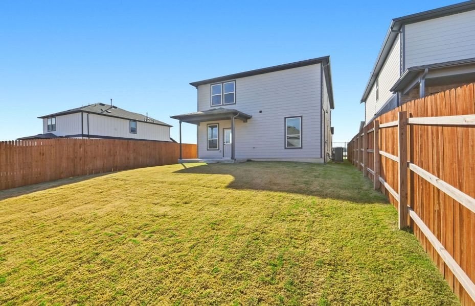 Exterior details and patio area of a home in Saddleback at Santa Rita Ranch, Liberty Hill (Image 4).
