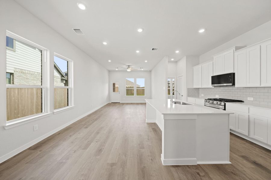 Furnished interior view inside a new home in Creekland Village at Bridgeland, Cypress (Image 7).