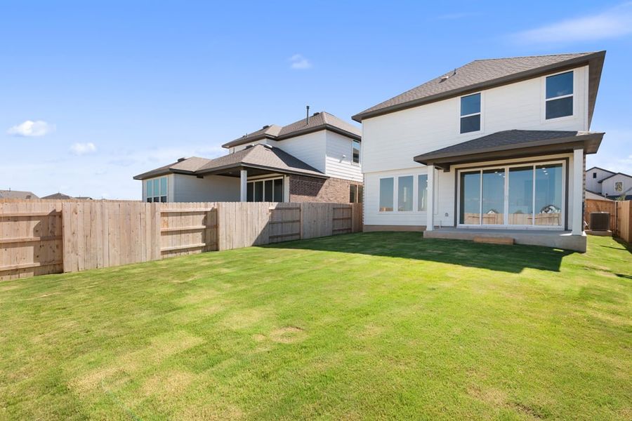 Exterior details and patio area of a home in Terrace Collection at Lariat, Liberty Hill (Image 23).