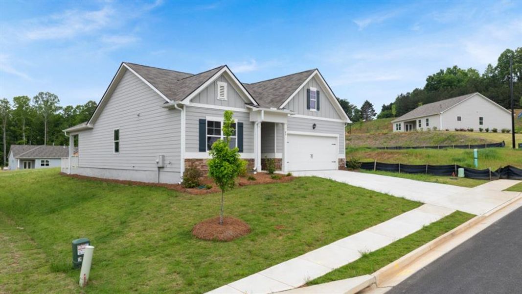 Front exterior of a new home in Lost Creek, Dallas, GA, highlighting curb appeal (Image 20).