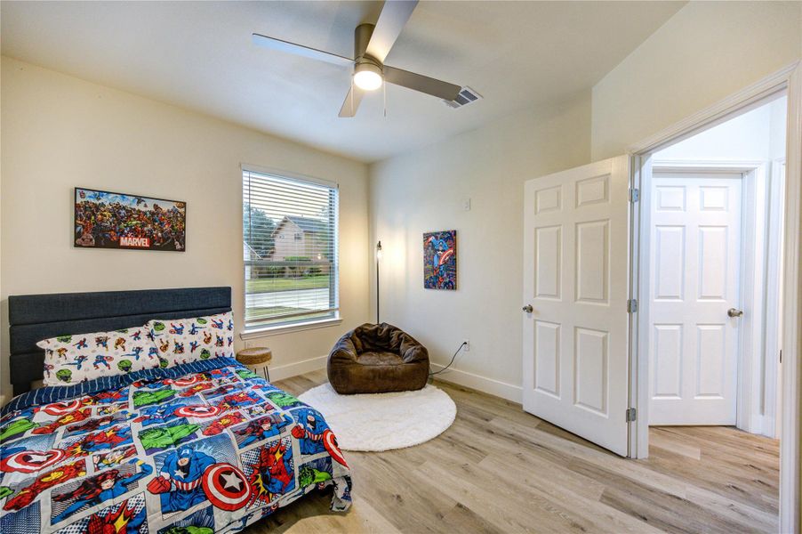 Bright and inviting first-floor bedroom with modern finishes and ample natural light.